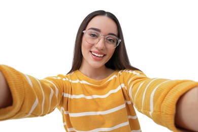 Photo of Smiling young woman taking selfie on white background