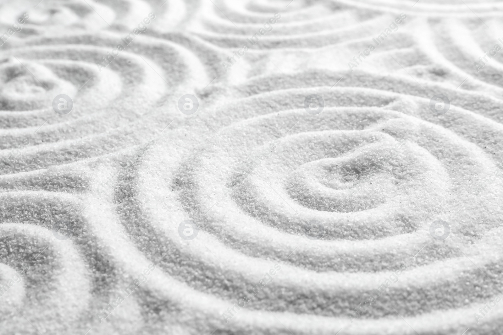 Photo of White sand with pattern as background. Zen, meditation, harmony