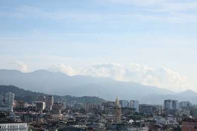 Batumi, Georgia - October 12, 2022: Picturesque view of modern city near mountains