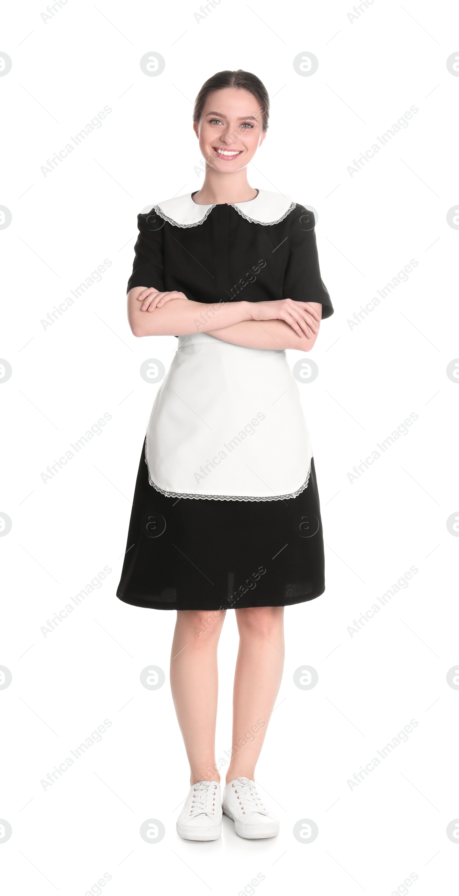 Photo of Young chambermaid in uniform on white background