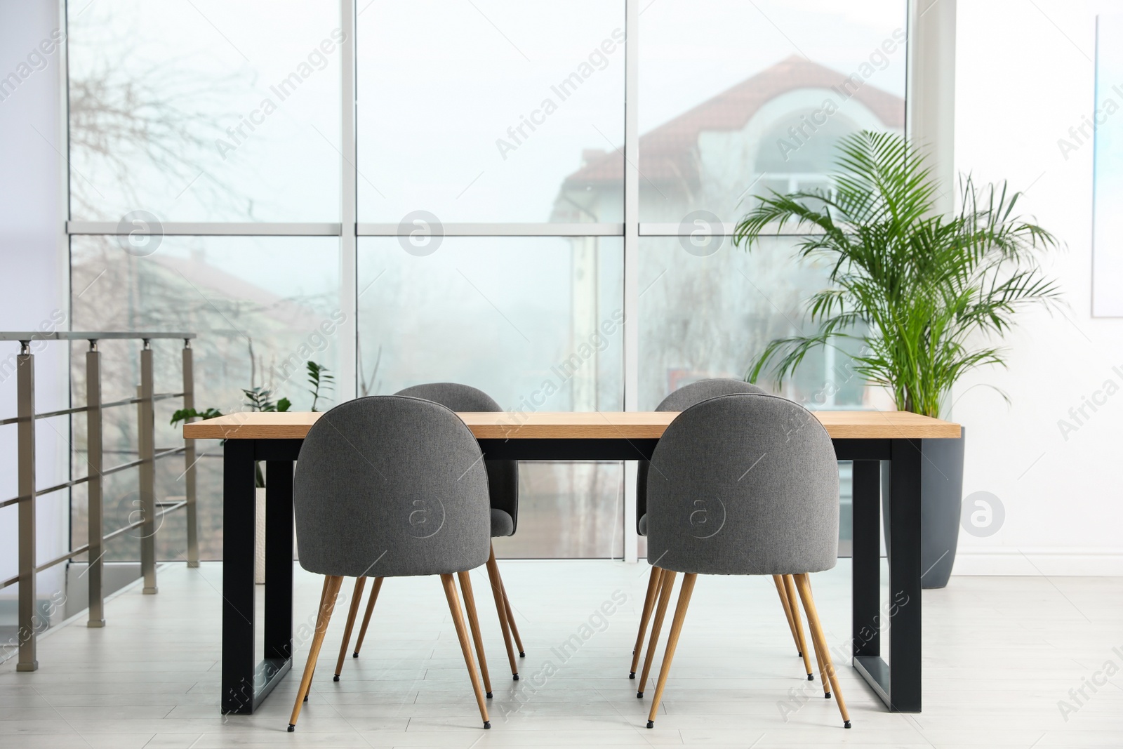 Photo of Modern room interior with chairs and table