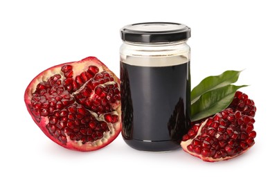 Glass jar of pomegranate sauce and fresh ripe fruit on white background