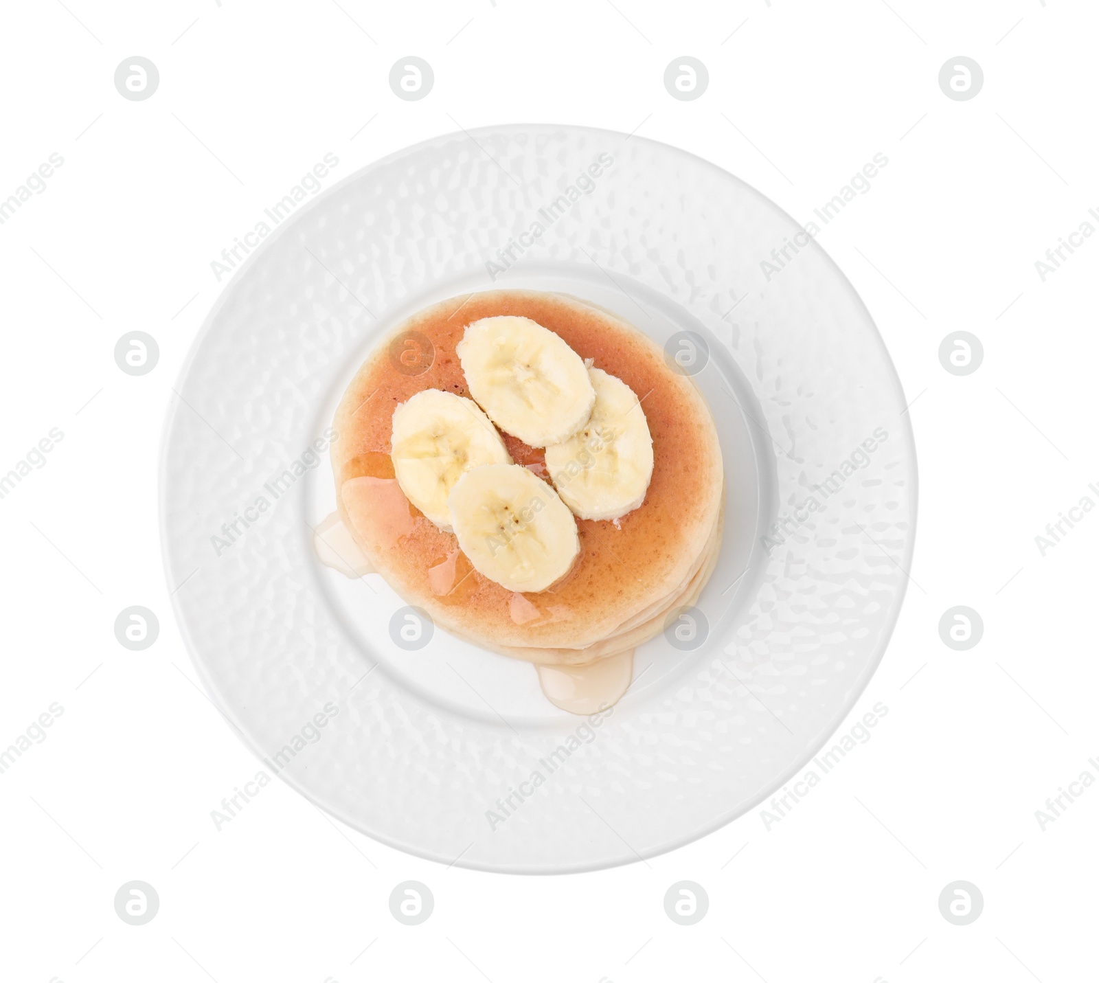 Photo of Delicious pancakes with banana slices and honey isolated on white, top view