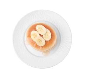 Delicious pancakes with banana slices and honey isolated on white, top view