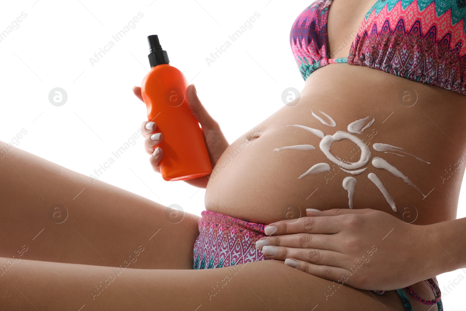 Photo of Pregnant woman with sun protection cream on white background, closeup