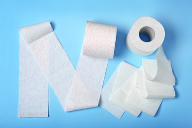 Photo of Flat lay composition with toilet paper on color background