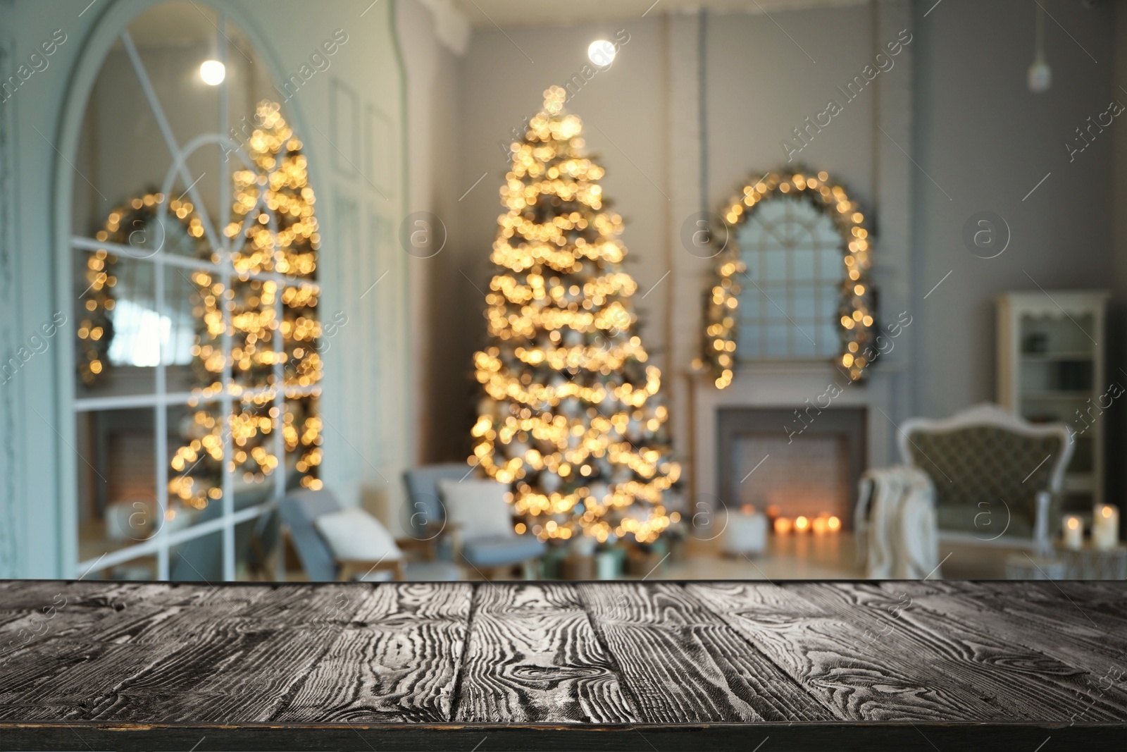 Image of Empty wooden surface and blurred view of room decorated for Christmas