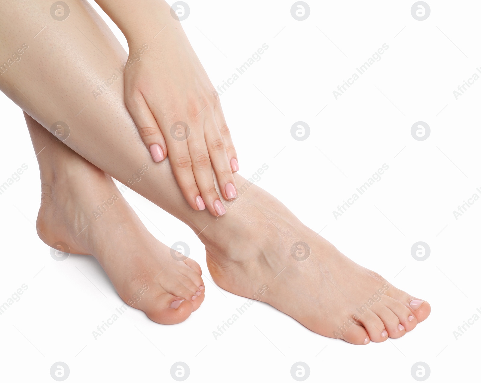 Photo of Woman with neat toenails after pedicure procedure isolated on white, closeup