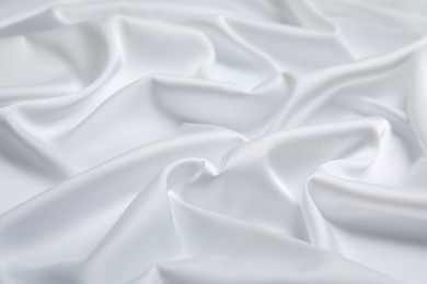 Photo of Texture of delicate white fabric as background, closeup