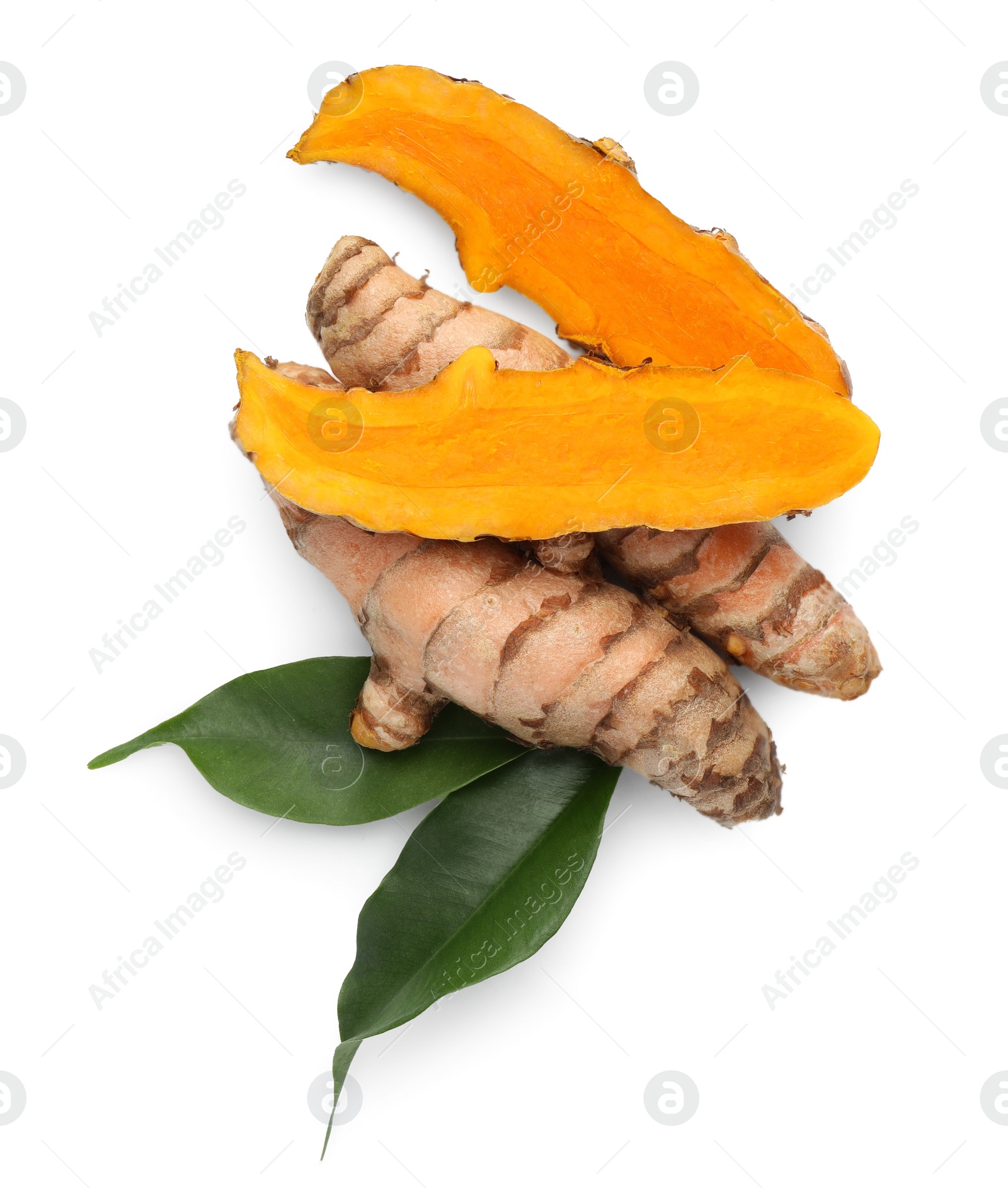 Photo of Fresh turmeric roots and green leaves isolated on white, top view