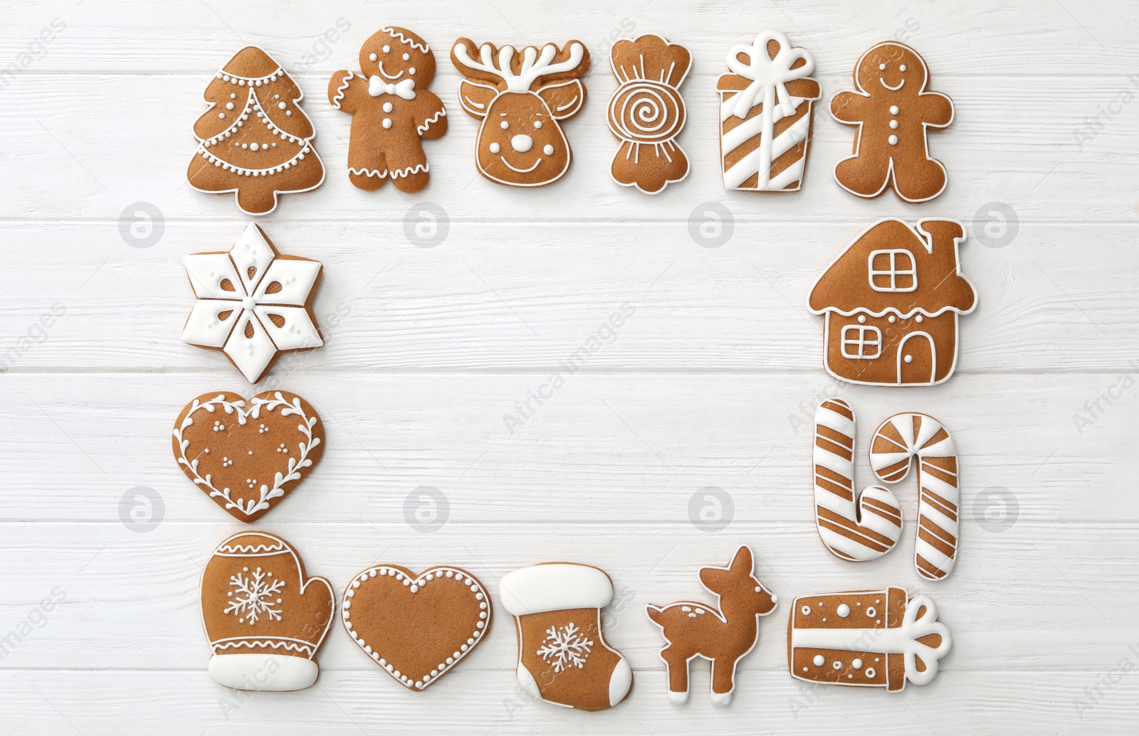 Photo of Frame of different Christmas cookies on white wooden table, flat lay. Space for text