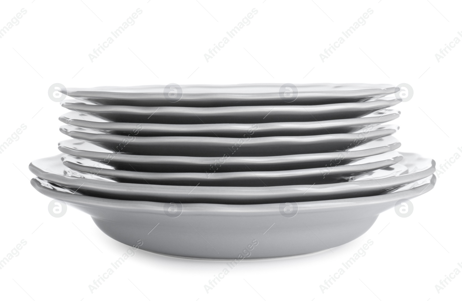 Photo of Stack of ceramic plates on white background