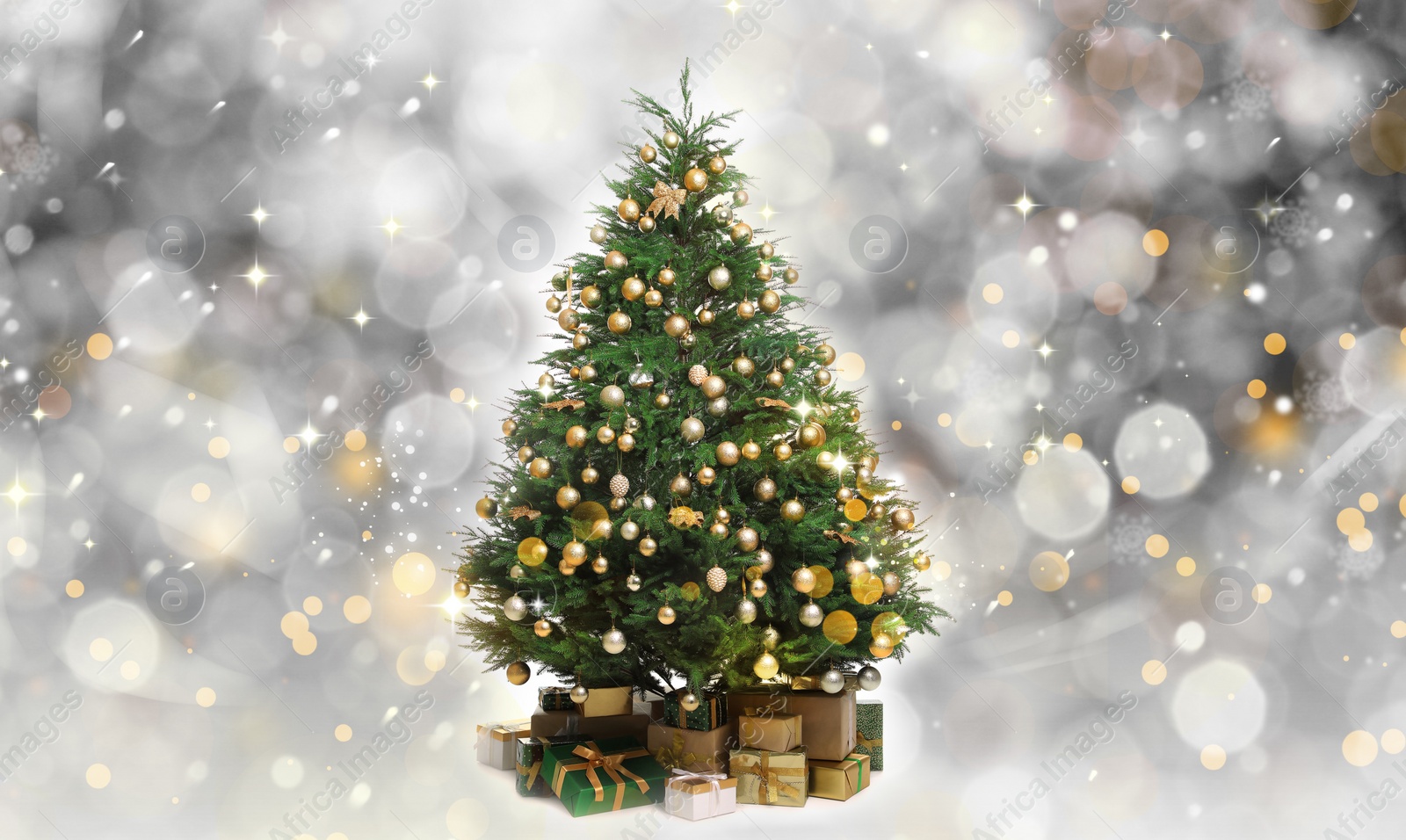 Image of Beautifully decorated Christmas tree and gift boxes on blurred background. Bokeh effect