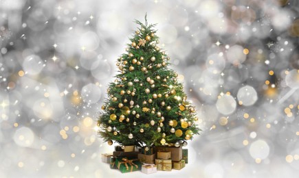 Image of Beautifully decorated Christmas tree and gift boxes on blurred background. Bokeh effect