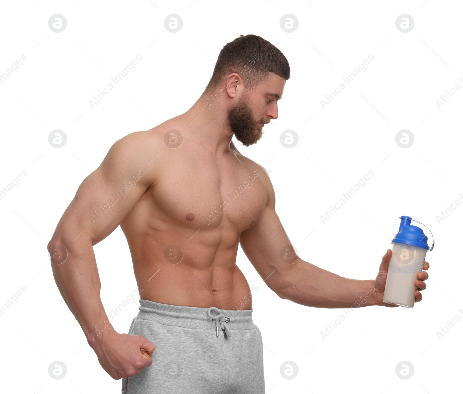 Photo of Young man with muscular body holding shaker of protein on white background