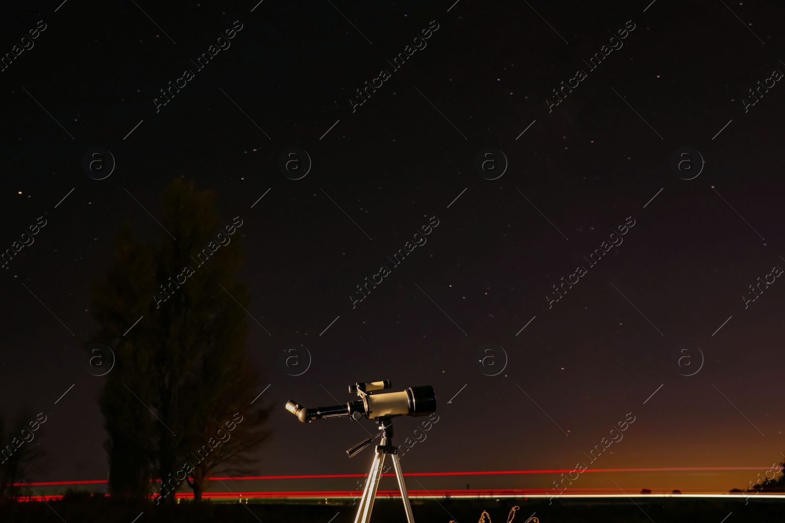 Photo of New astronomy telescope outdoors, space for text. Picturesque view of shiny stars at night