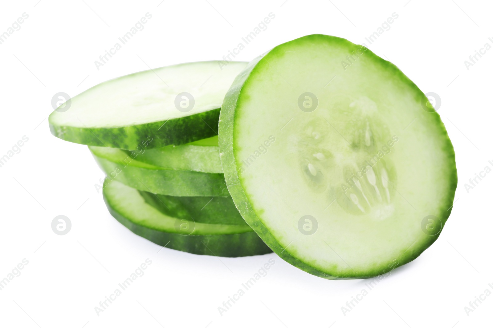 Photo of Slices of fresh cucumber on white background