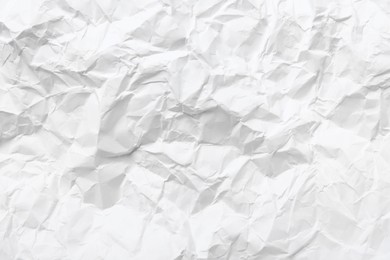 Sheet of white crumpled paper as background, closeup