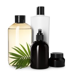 Photo of Different bottles of shampoo and jar of cosmetic product on white background