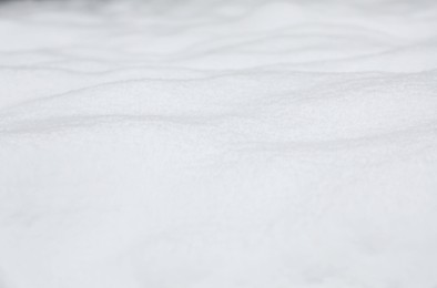 Photo of Beautiful white snow outdoors, closeup. Winter season