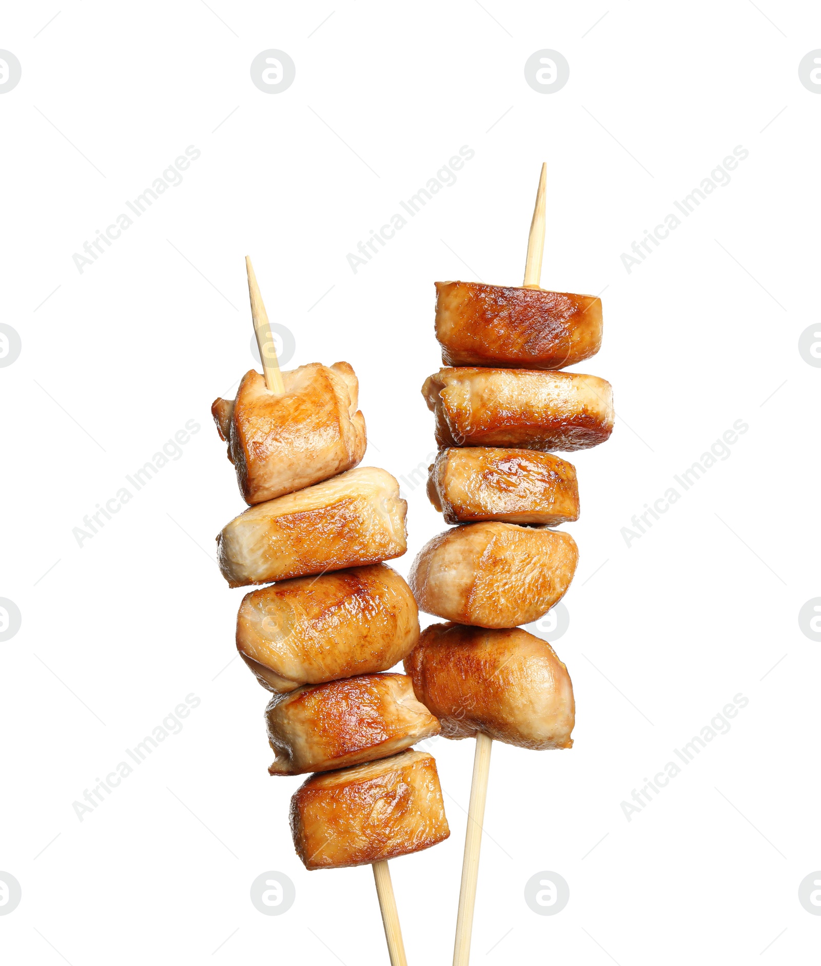 Photo of Delicious chicken shish kebabs on white background