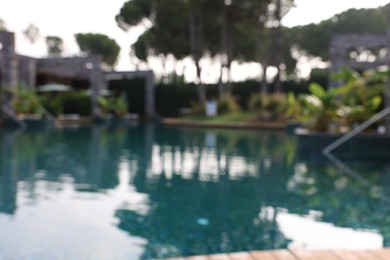 Photo of Blurred view of outdoor swimming pool at luxury resort