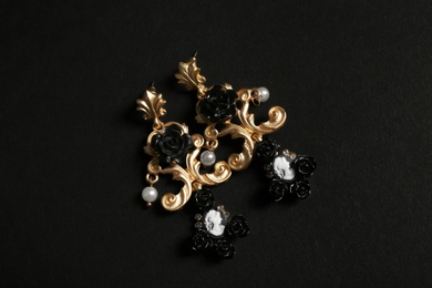 Beautiful earrings on black background. Luxury jewelry