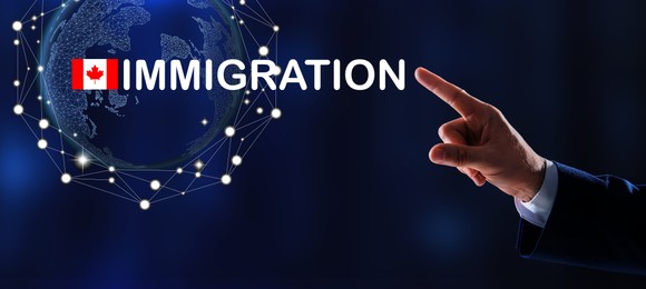 Image of Immigration. Businessman touching digital screen with world globe, word and flag of Canada on dark blue background, closeup