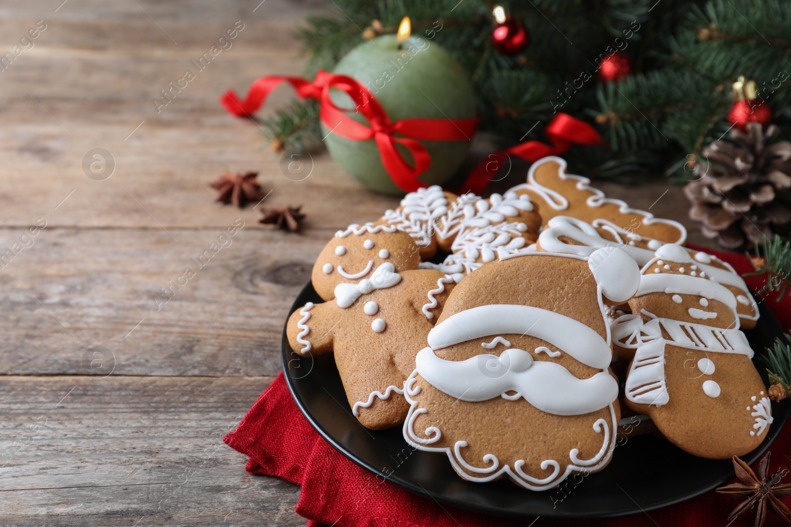 Photo of Delicious Christmas cookies on wooden table. Space for text