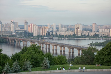 Photo of KYIV, UKRAINE - MAY 23, 2019: Beautiful view of Paton bridge over Dnipro river