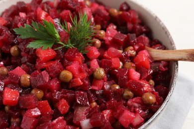 Delicious fresh vinaigrette salad in bowl, closeup