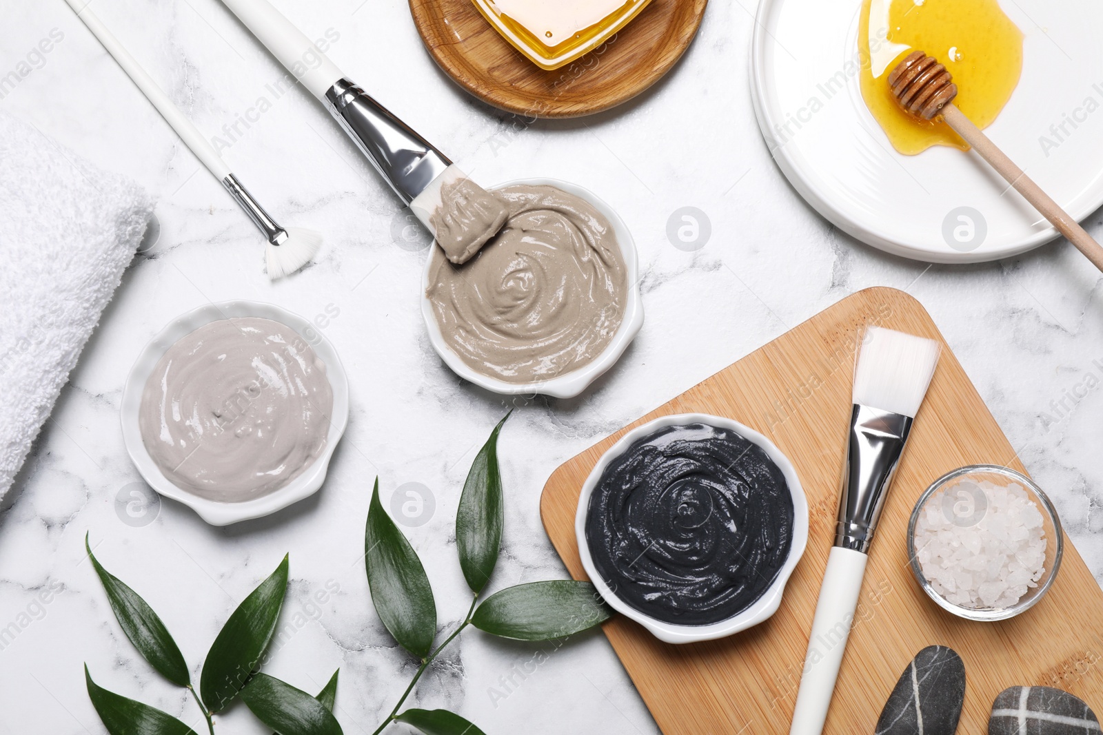 Photo of Flat lay composition with spa products for masks on white marble table