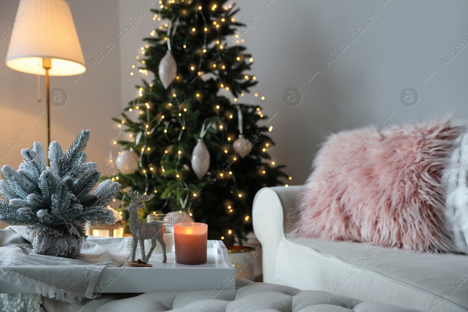 Photo of Beautiful Christmas tree in living room. Interior design