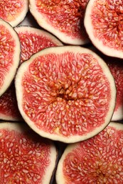 Pieces of fresh ripe figs on table, top view