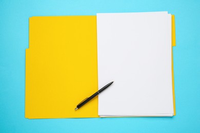 Photo of Yellow file with blank sheets of paper and pen on turquoise background, top view. Space for design