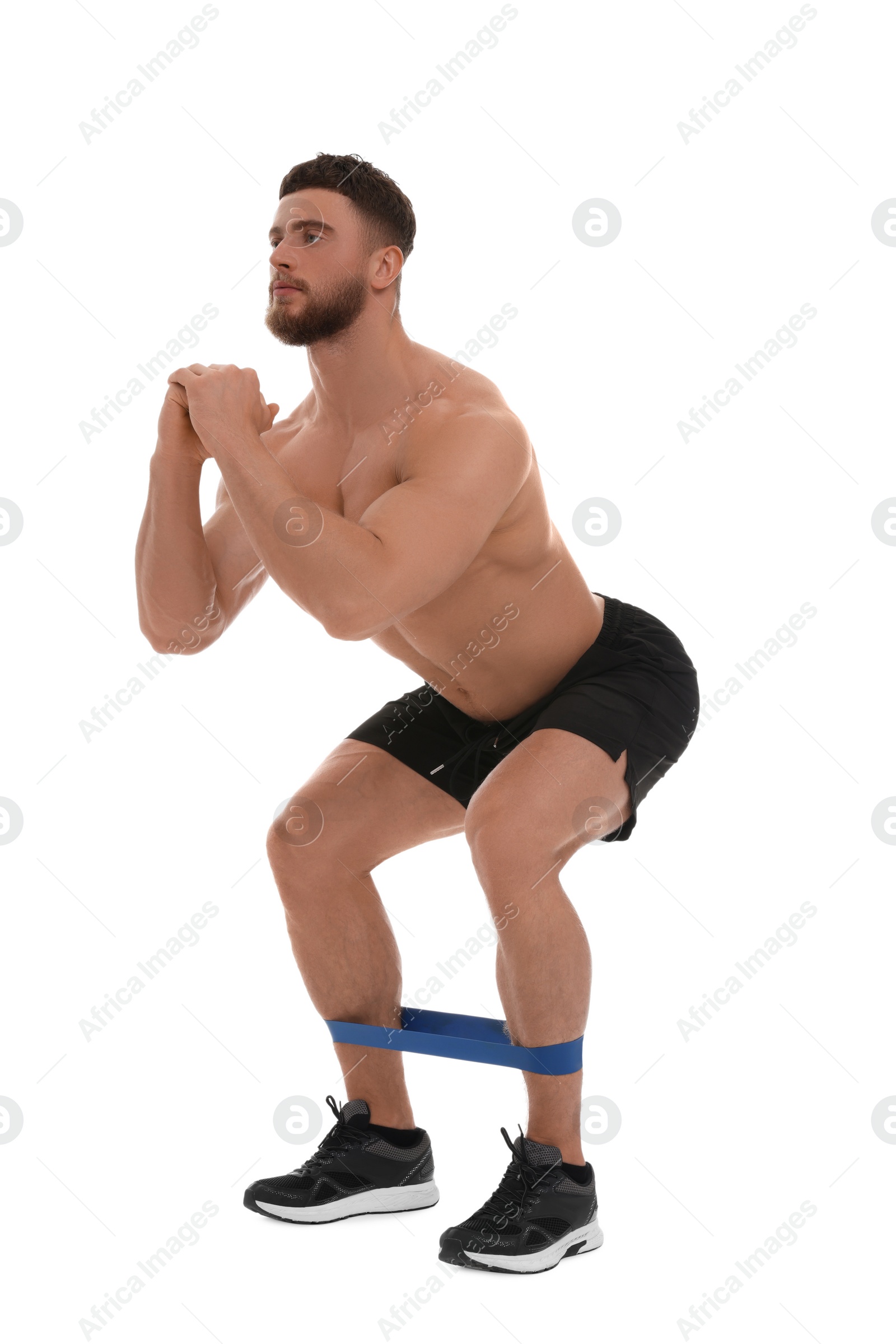 Photo of Young man exercising with elastic resistance band on white background