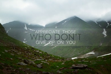 Image of Appreciate Those Who Don't Give Up On You. Inspirational quote reminding to be grateful for support from caring people. Text against beautiful mountain landscape