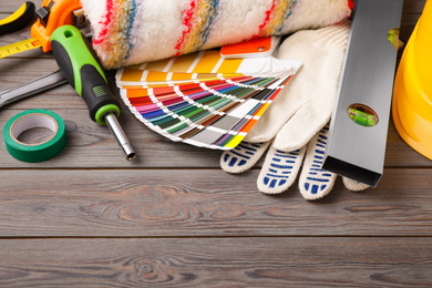 Photo of Different construction tools on grey wooden background