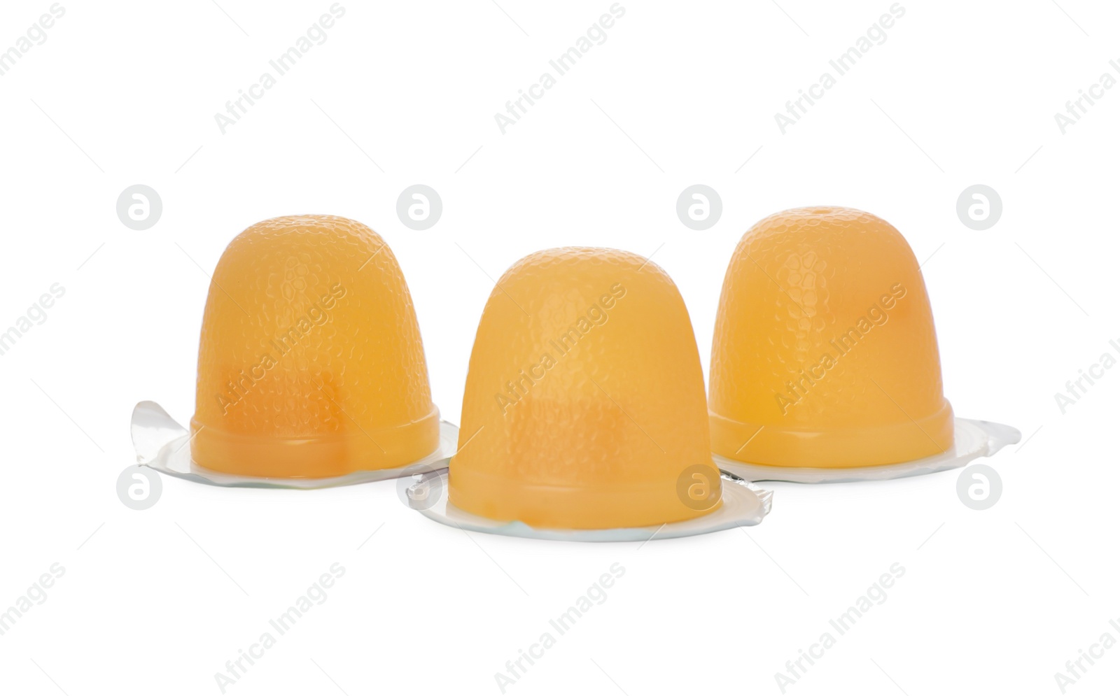 Photo of Delicious yellow jelly cups on white background