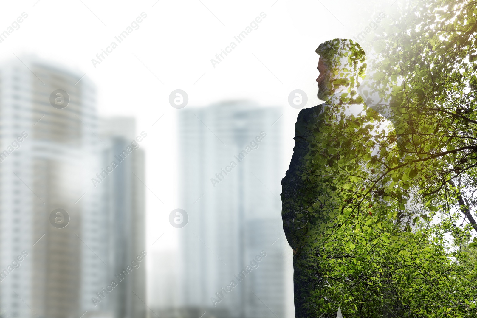 Image of Double exposure of businessman and green leaves in city