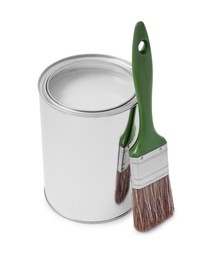 Photo of Can with paint and brush on white background