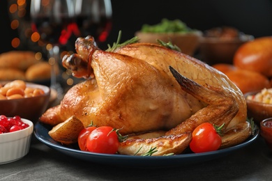 Photo of Traditional festive dinner with delicious roasted turkey served on table