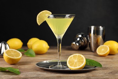 Photo of Lemon Martini cocktail and fresh fruits on wooden table