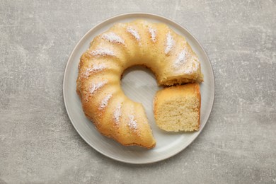 Photo of Delicious freshly baked sponge cake on gray table, top view