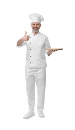 Photo of Happy chef in uniform with wooden board showing thumbs up on white background