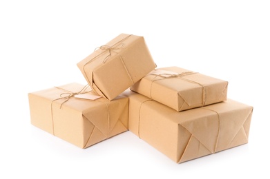 Photo of Parcels wrapped in kraft paper on white background