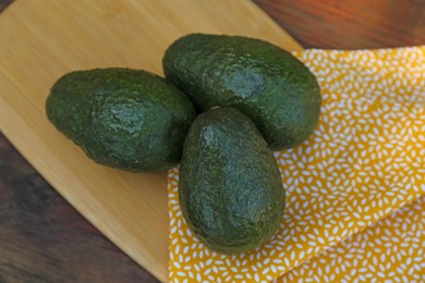 Photo of Fresh avocados on wooden table, flat lay