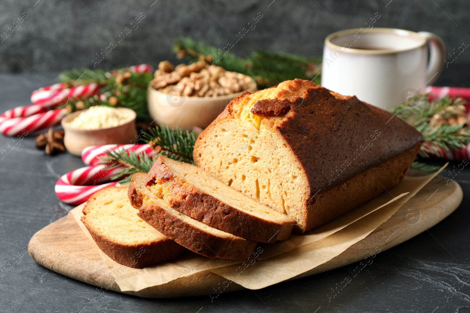 Photo of Fresh sliced gingerbread cake on grey table