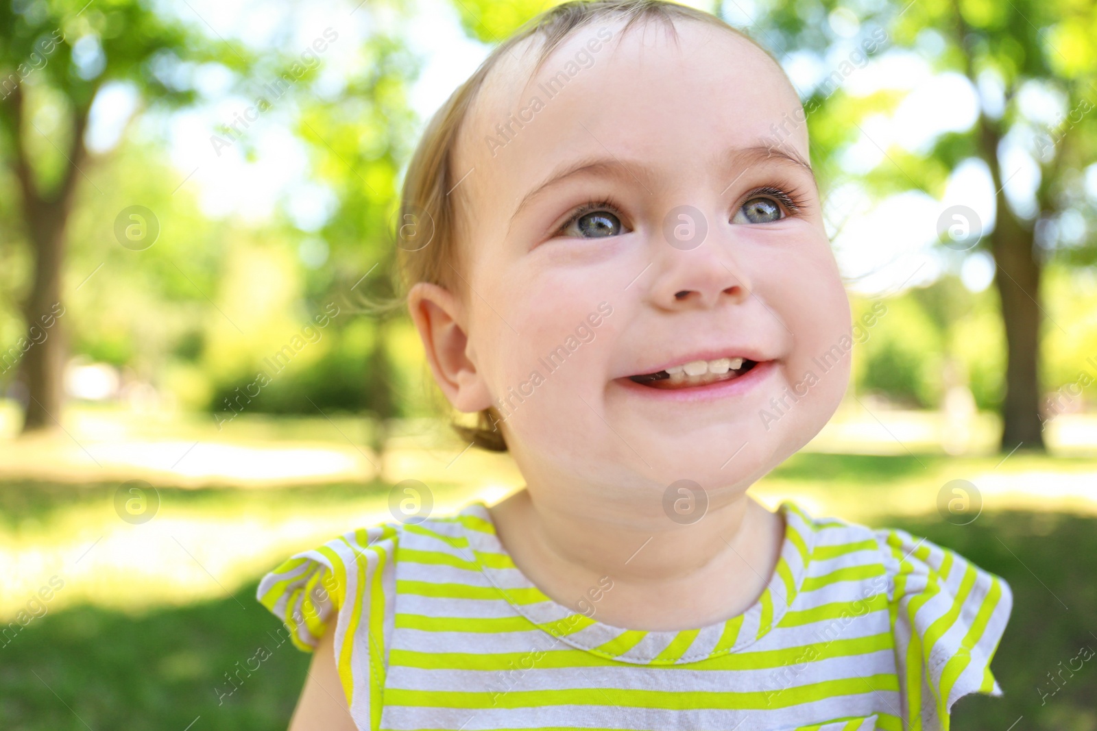 Photo of Portrait of cute baby girl in park on sunny day