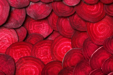 Photo of Cut beets as background. Backdrop for design